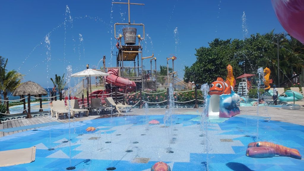Family friendly Kids Splash pad water Park with fountains and slides at beaches Negril all-inclusive luxury resort in Jamaica by DWEPP Jamaica